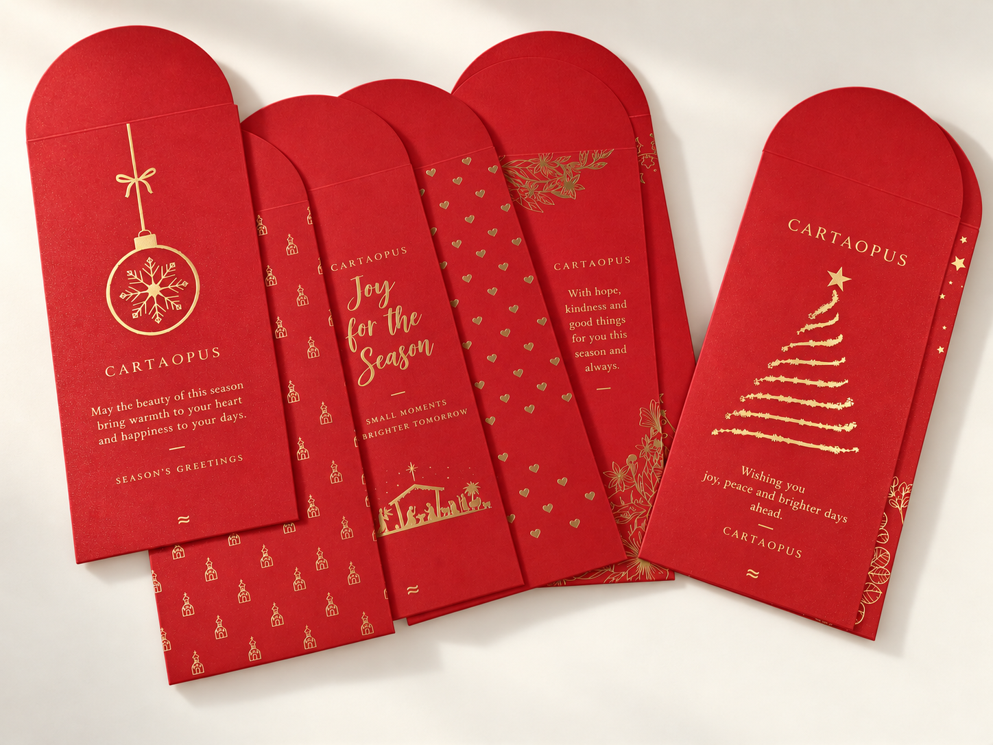 Coordinated red seasonal paper sleeves with rounded ends and gold-coloured decoration.