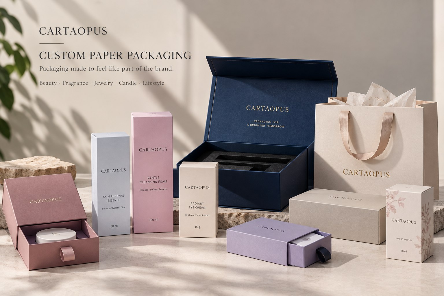 A coordinated fragrance presentation with an eau de parfum carton, rigid box and paper bag.