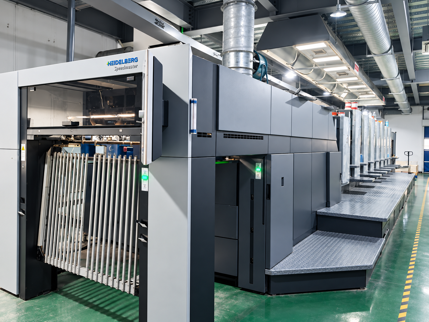 Wide view of a Heidelberg printing press in a packaging production environment.
