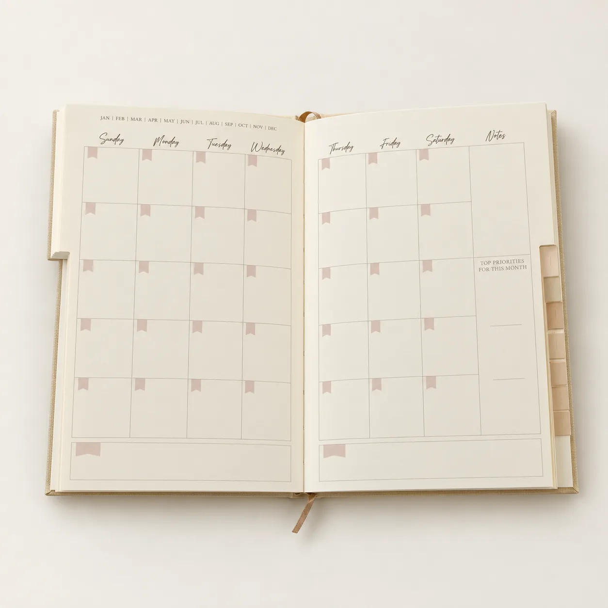 Open Daily Planner showing a monthly planning spread and index tabs.