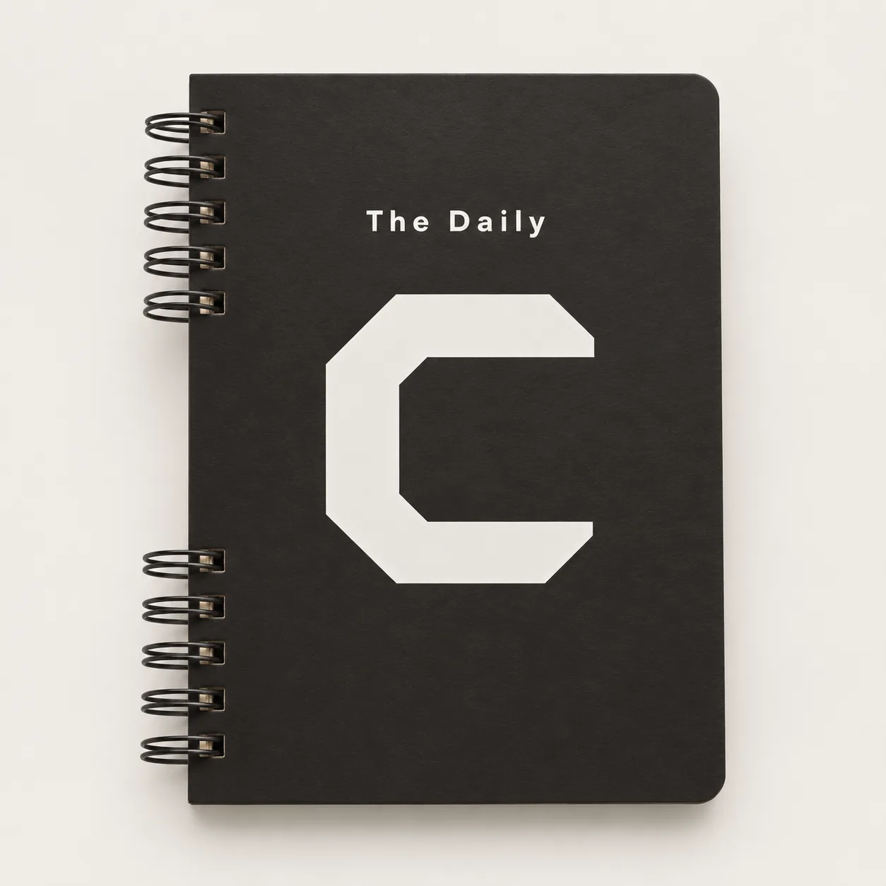 Black Wire-O notebook with a large white C graphic.