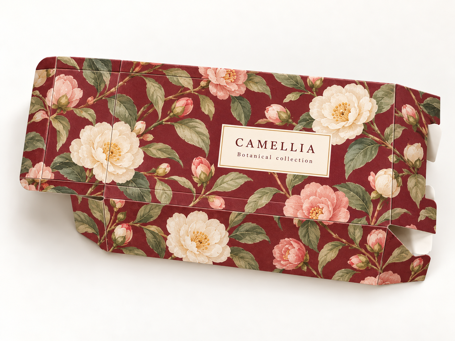 Red floral folding carton shown open to reveal its panels and tuck structure.