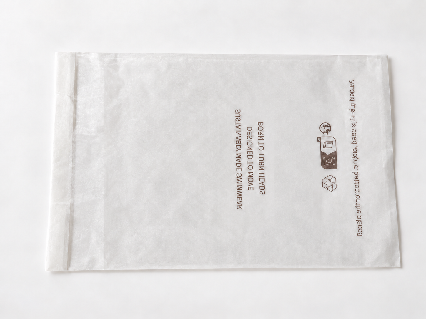 Glassine paper bag showing printed handling information.